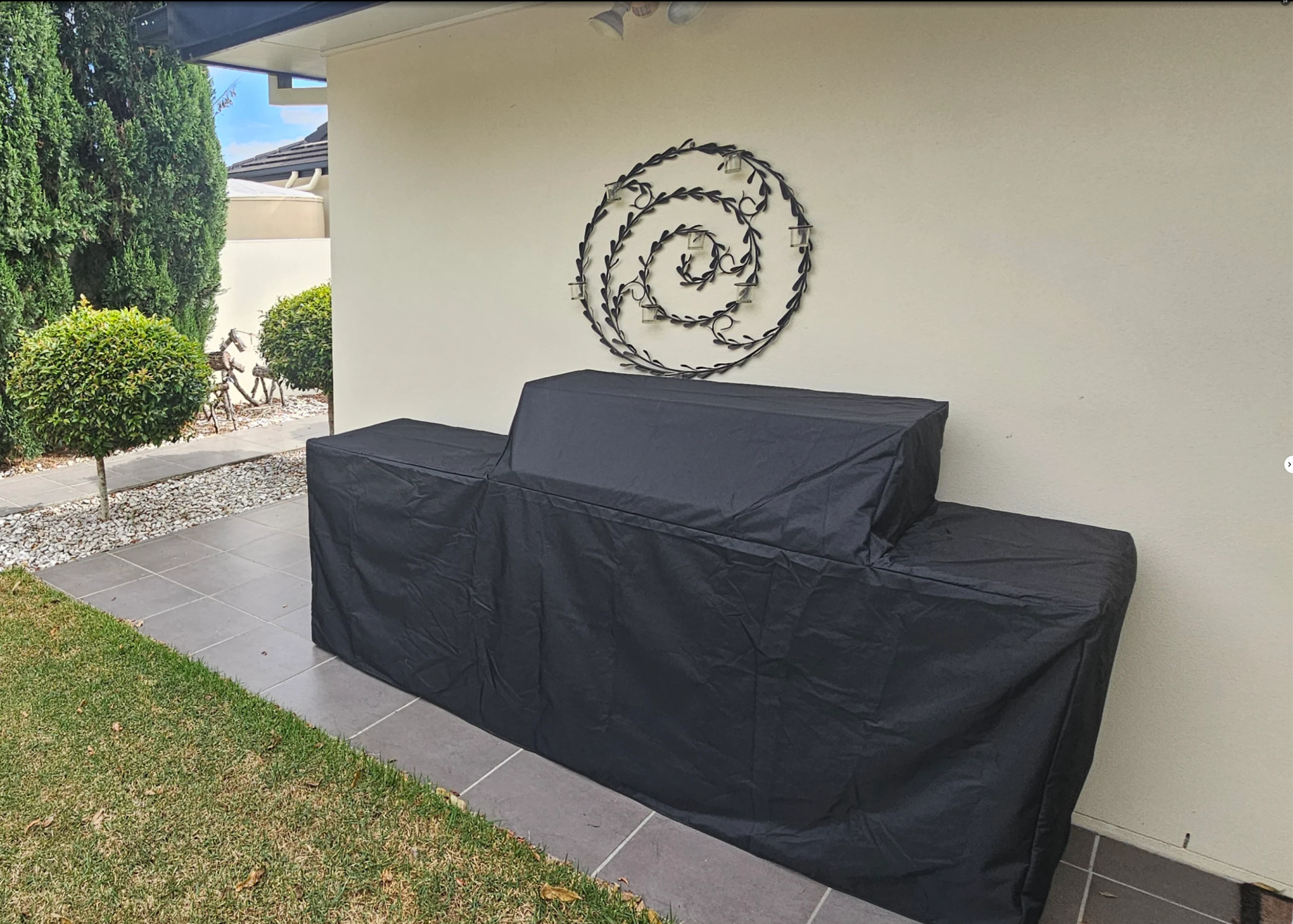 Custom made grill cover in black fitted over a grill kitchen – The Cover Company Canada